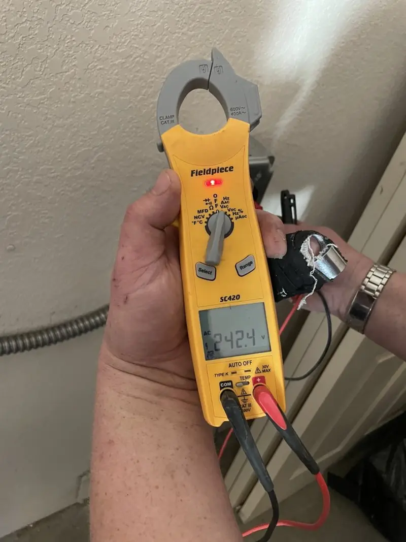 Voltage testing with clamp meter during Generator Installation in Omro